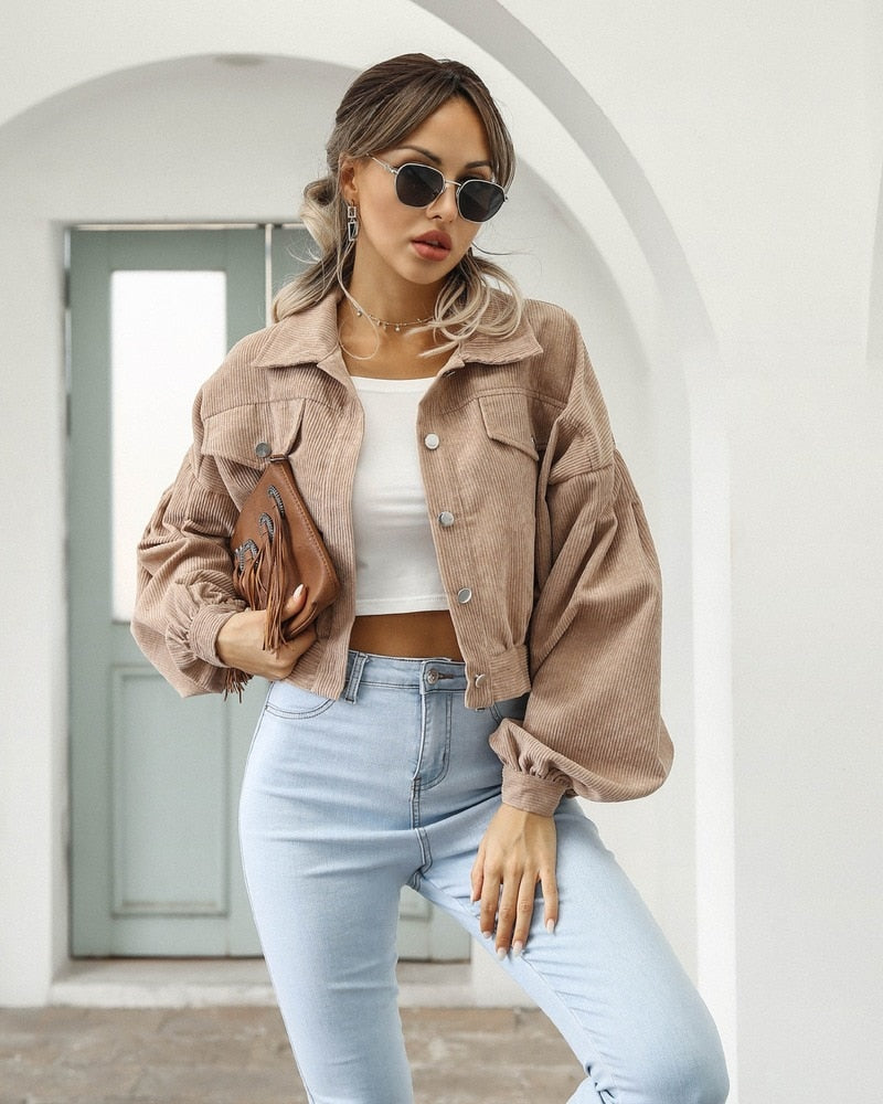 Taupe cropped jacket with flap pockets and button front, long puff sleeves