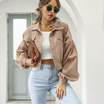 Taupe cropped jacket with flap pockets and button front, long puff sleeves