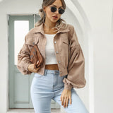 Taupe cropped jacket with flap pockets and button front, long puff sleeves