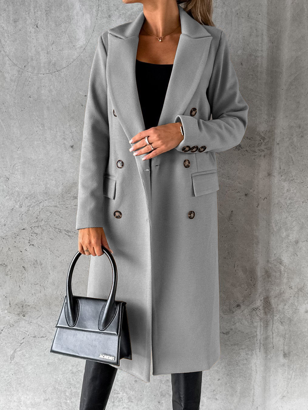 Gray double-breasted overcoat with notch lapels, long sleeves, and buttoned pockets