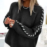 Black chunky knit pullover sweater with contrast stitched puff sleeves and crew neck