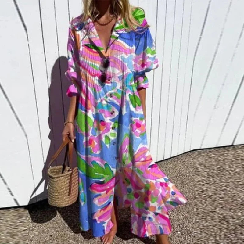 Bohemian maxi dress with bright blue, pink, and green floral print, V-neck, buttons