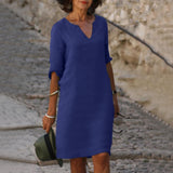 Navy blue V-neck midi summer dress with draped sleeve detail and belly coverage