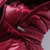 Dark red ultralight puffer jacket with front zipper and hood edge detail