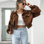 Brown cropped jacket with flap pockets and button front, long puff sleeves