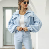 Light blue cropped jacket with flap pockets and button front, long puff sleeves