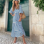 Bohemian maxi dress in blue with white geometric pattern, short sleeves
