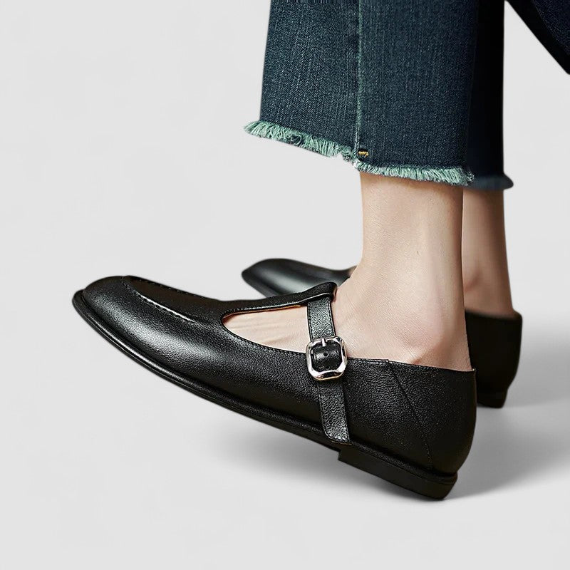 Black Mary Jane flats with low heel, buckle strap and cutout toe