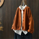 Orange knit cardigan with button front, patch pockets, ribbed cuffs and hem.