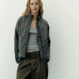 Dark green cropped quilted jacket with full zip and drawstring hem