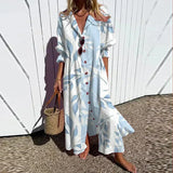 Bohemian maxi dress in light blue and white stripe print, V-neck, button front, ruffle sleeves