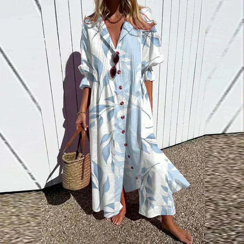 Bohemian maxi dress in light blue and white stripe print, V-neck, button front, ruffle sleeves