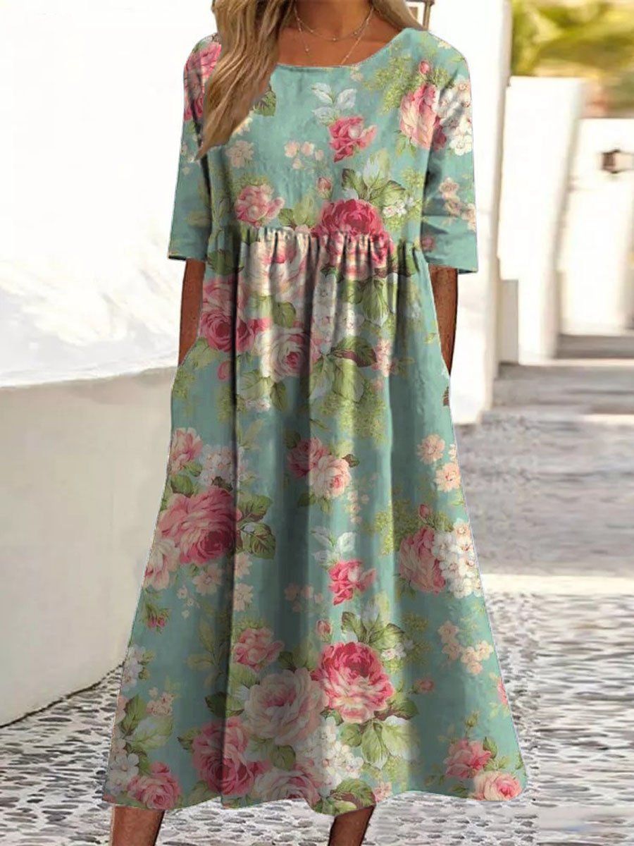 Mint green midi dress with pink floral print, gathered waist and short sleeves