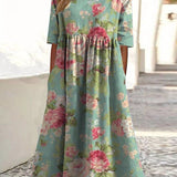 Mint green midi dress with pink floral print, gathered waist and short sleeves