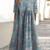 Light blue midi dress with small floral print, short sleeves, gathered empire waist