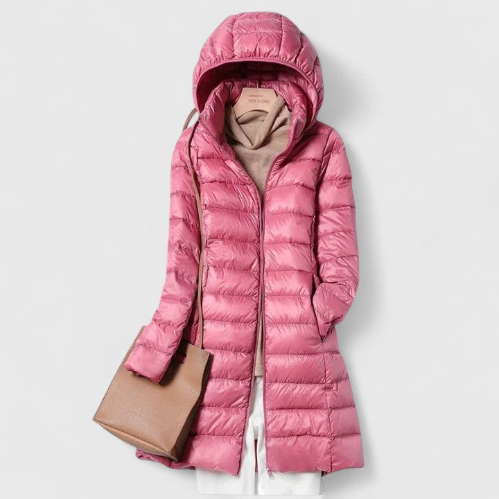 Long hooded puffer jacket with front zipper, pink colorway with quilted panels.