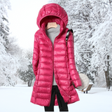 Bright pink hooded long puffer jacket with zip front and quilted panels