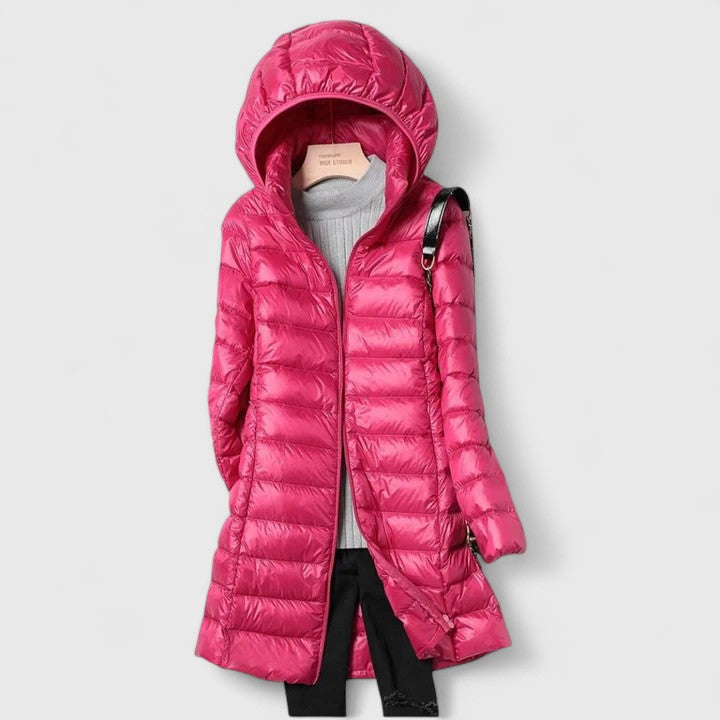 Hooded long puffer jacket with front zipper, hot pink colorway with quilted texture.