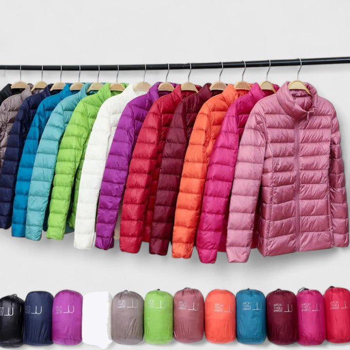 Quilted puffer jackets assortment with zip front and stand collar, hanging on rack