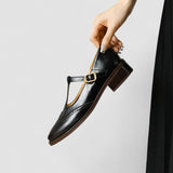 Black Mary Jane shoe with side buckle strap and textured finish on low heel