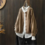Camel knit cardigan with button front, patch pockets, ribbed cuffs and hem.