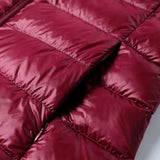 Dark red quilted puffer jacket with stitched baffles and soft insulated padding