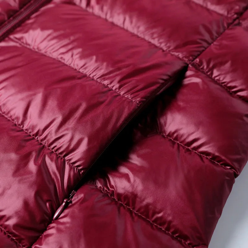 Dark red quilted puffer jacket with stitched baffles and soft insulated padding