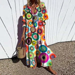 Bohemian maxi dress with colorful circle pattern, V-neck, button front, short puff sleeves