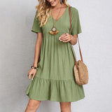 Green V-neck tiered midi dress with short sleeves, relaxed fit