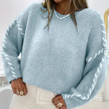 Light blue chunky knit pullover sweater with contrast stitched puff sleeves