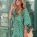 Bohemian maxi dress in green with pink floral print and short puff sleeves