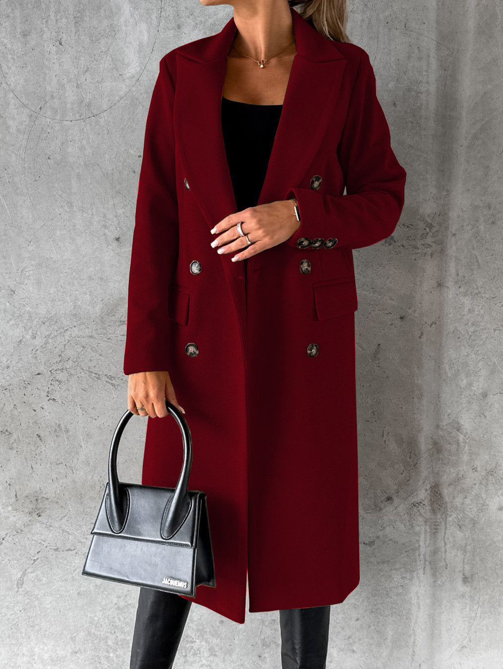 Burgundy double-breasted overcoat with notch lapels, long sleeves, and buttoned flap pockets