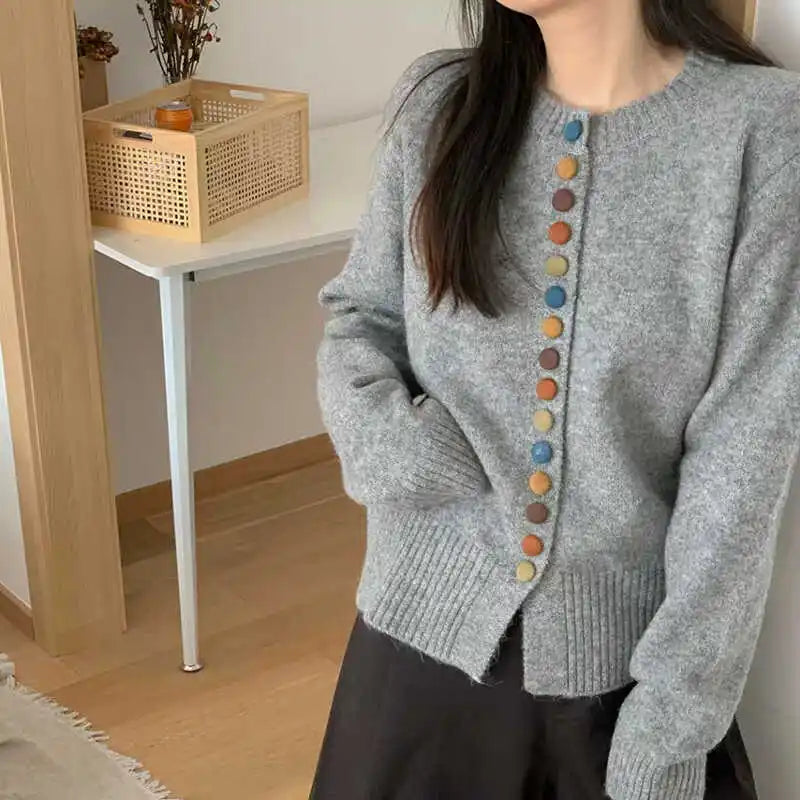 Heather gray knit cardigan with long sleeves and front button placket with multicolor buttons