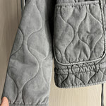 Gray cropped quilted jacket sleeve and pocket with drawstring hem