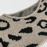 Leopard-pattern knit pullover with cream base and black spots at the neckline