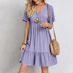 Lavender V-neck tiered midi dress with short sleeves and gathered waist