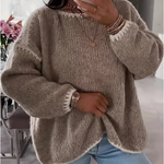 Beige textured knit pullover sweater with crew neck and ribbed cuffs, relaxed fit