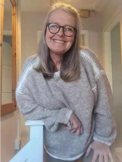 Heather gray knit pullover sweater with round neck and ribbed cuffs, relaxed fit