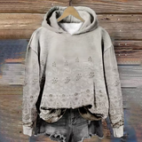 Light gray hoodie with eyelet embroidery, gray hood lining, and kangaroo pocket