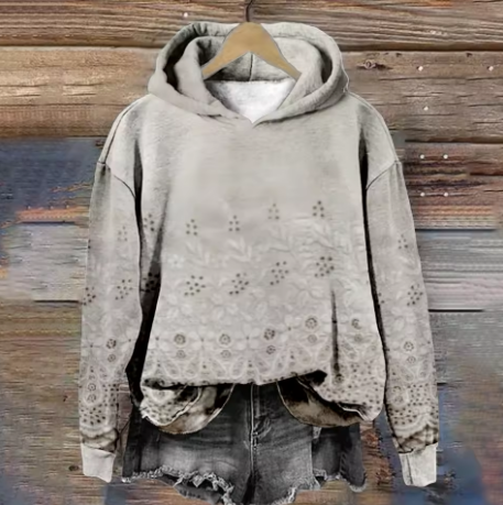 Light gray hoodie with eyelet embroidery, gray hood lining, and kangaroo pocket