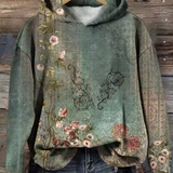 Warm green hoodie with floral front print and attached hood.