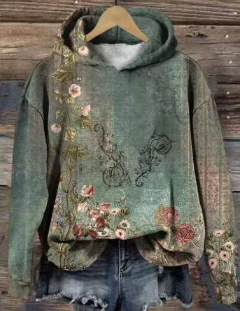 Warm green hoodie with floral front print and attached hood.