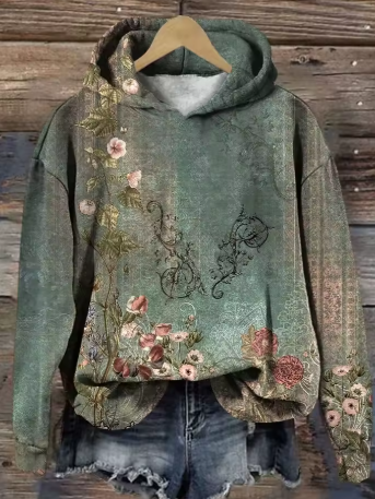 Warm green hoodie with floral front print and attached hood.