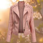 Light pink moto jacket with notched lapels, zip pockets, and zipper front closure