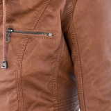 Close-up of brown jacket chest pocket with metal zipper and stitched seams