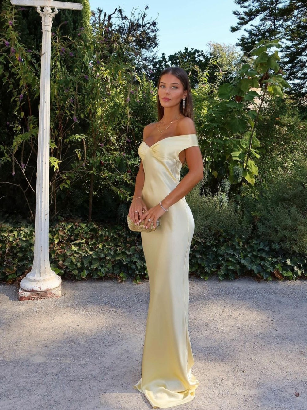 Light gold strapless satin evening dress with sweetheart neckline and long fitted skirt