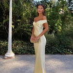 Light gold strapless satin evening dress with sweetheart neckline and long fitted skirt
