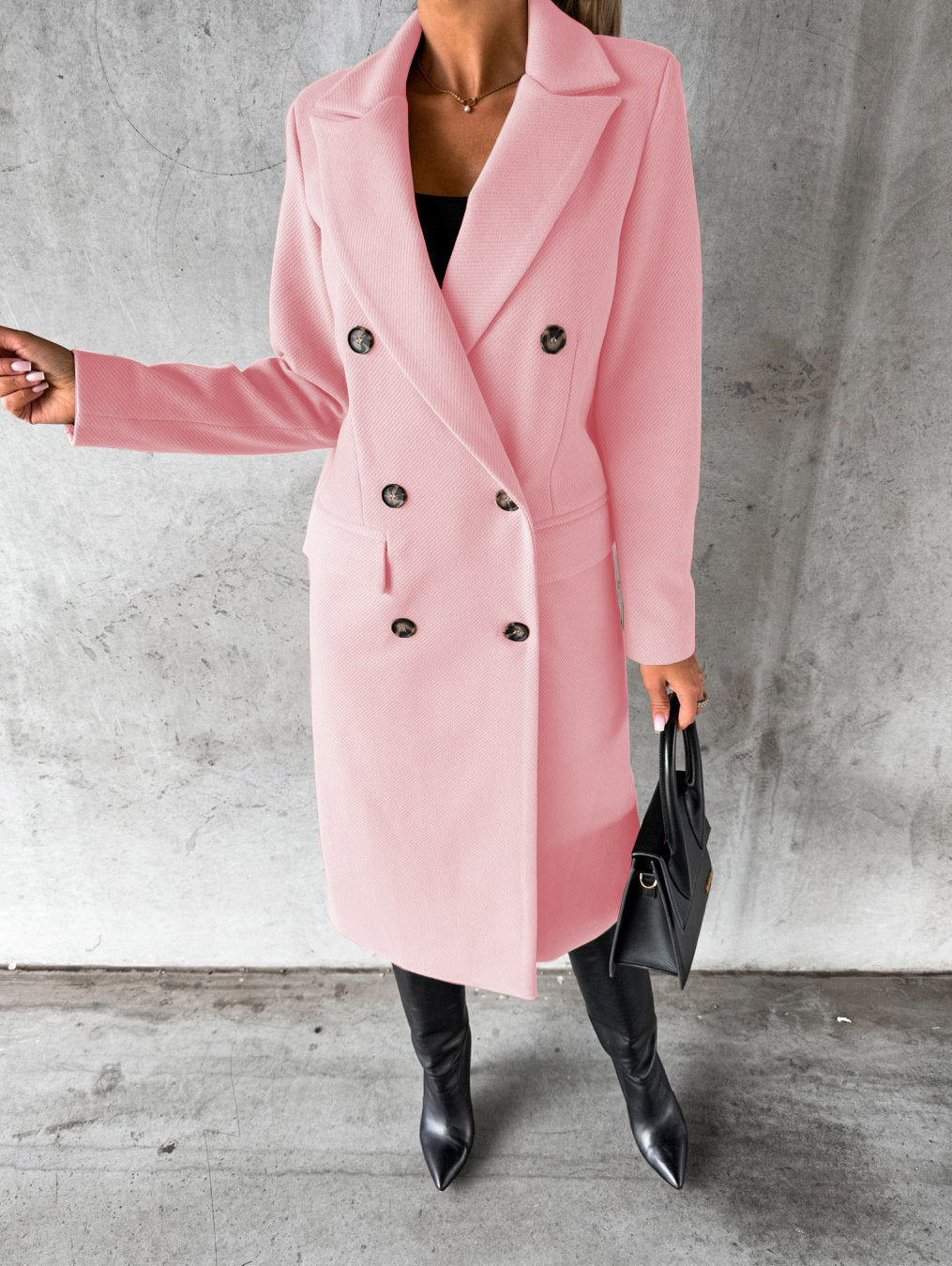 Pink double-breasted overcoat with notch lapels, long sleeves, and buttoned front closure