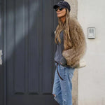 Cropped brown faux-fur jacket, side view with long sleeves and open front