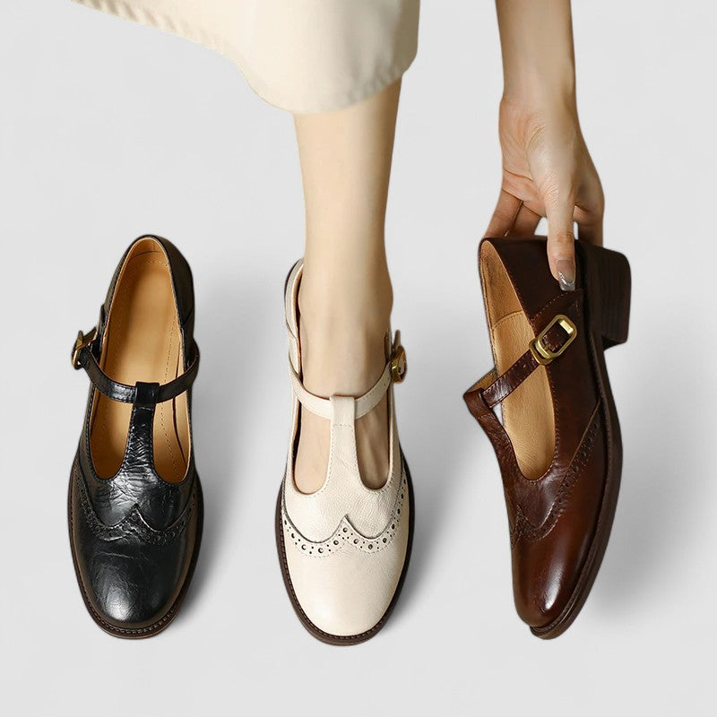 Set of Mary Jane shoes: black, white, and brown with buckle straps and low heels